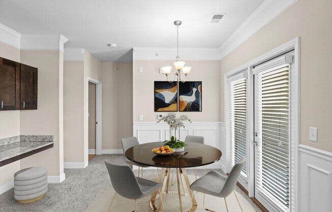 a dining room with a table and chairs