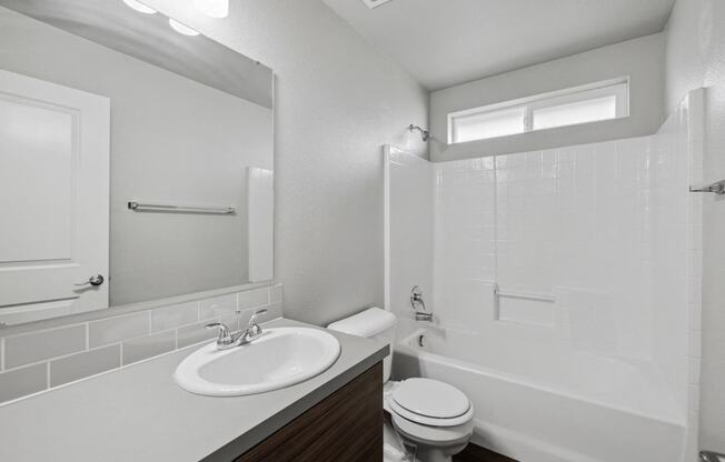 the preserve at ballantyne commons apartment bathroom with sink toilet and shower