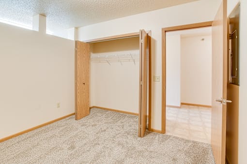 Bedroom with closet at Kassenborg Apartments, Moorhead, MN, 56560