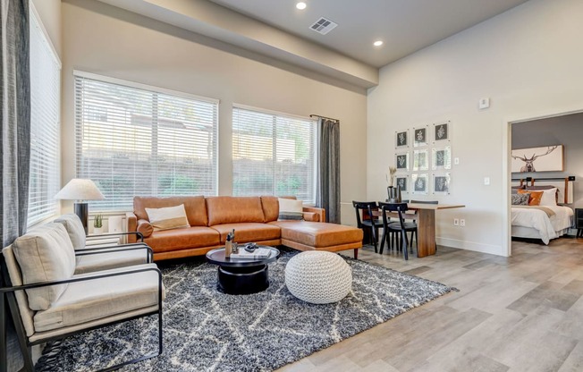 Living room with tall ceilings and large windows for natural light