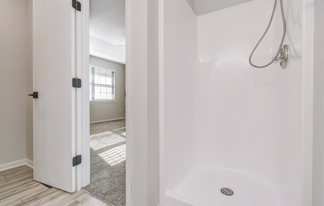 Standing shower inside platinum bathroom interior at The Arbor in Blue Springs, Missouri