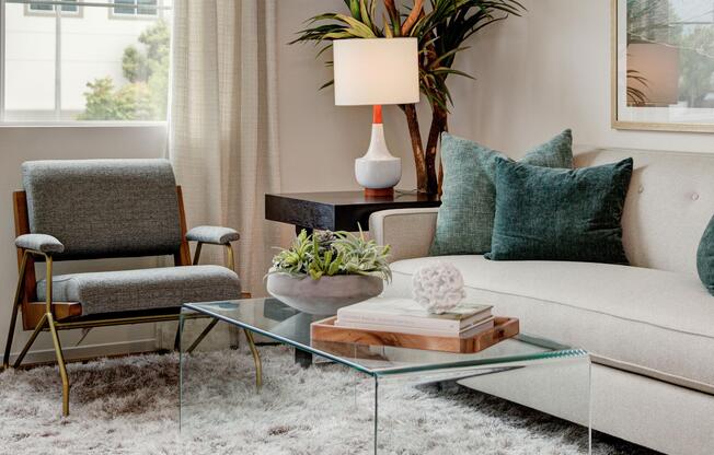 a living room filled with furniture and a window