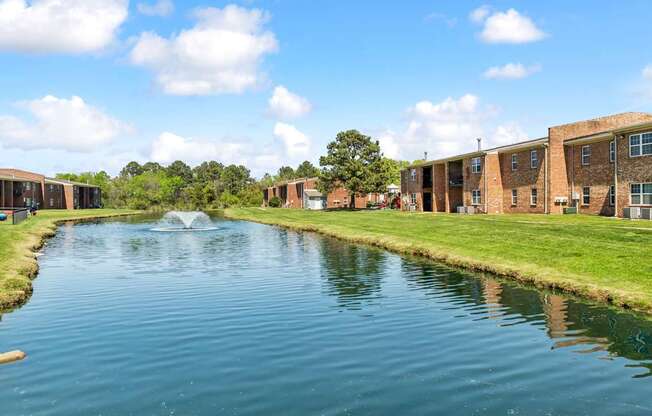 A body of water in front of a building.