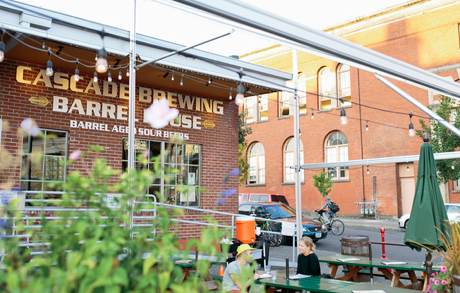 Patio view of Cascade Brewing Barrel House, popular with Modera Buckman apartment residents