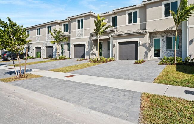 Brand new 3 bed 2.5 bath Townhouse with yard, garage and impact-resistant windows within Luxurious Community Terra Sol