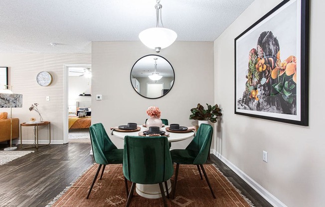 a dining room with a table and chairs