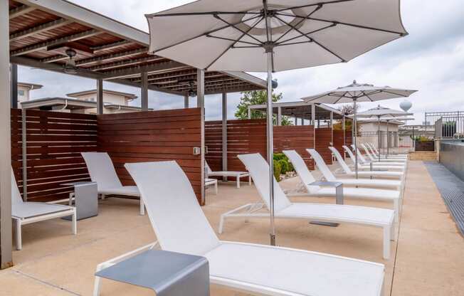 The sun deck with chaise lounge chairs at Berkshire Santal apartments