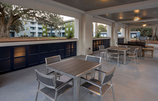 A patio with a table and chairs.