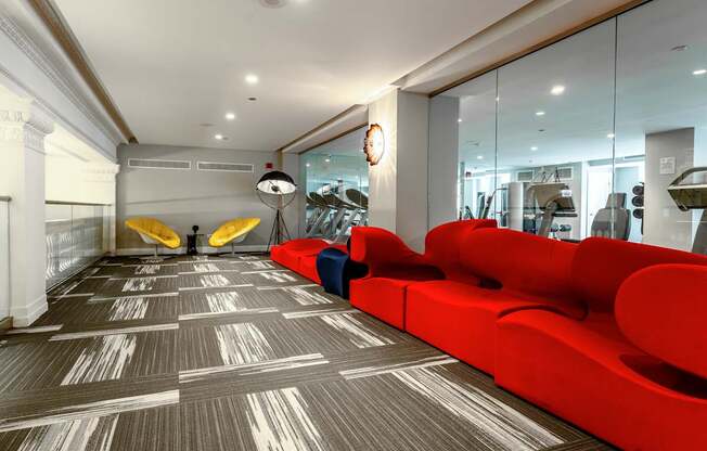 a red couch and two surfboards in a lobby