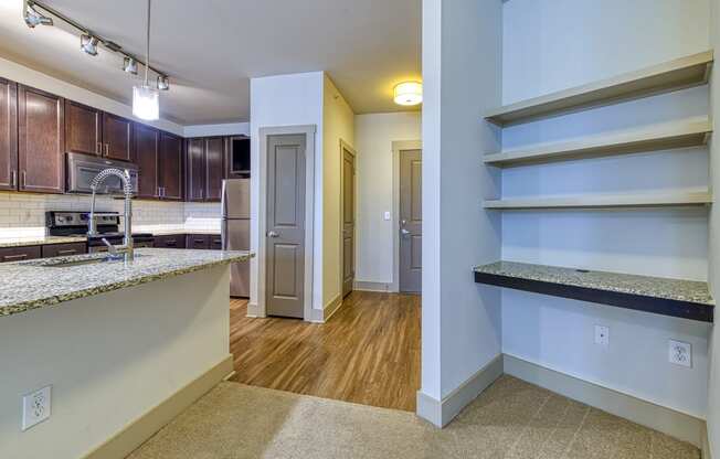Wood-look floors and ample storage in kitchen at 4700 Colonnade Apartments in Birmingham, AL