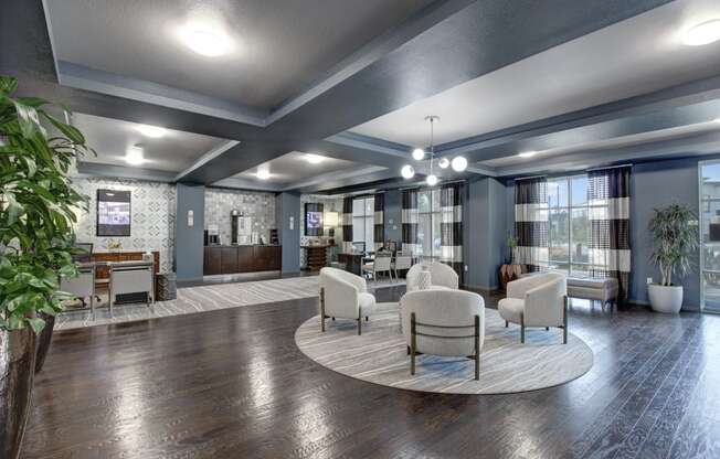 a resident clubhouse with couches chairs and tables