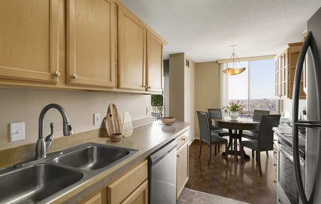 a kitchen and dining area in a 555 waverly unit