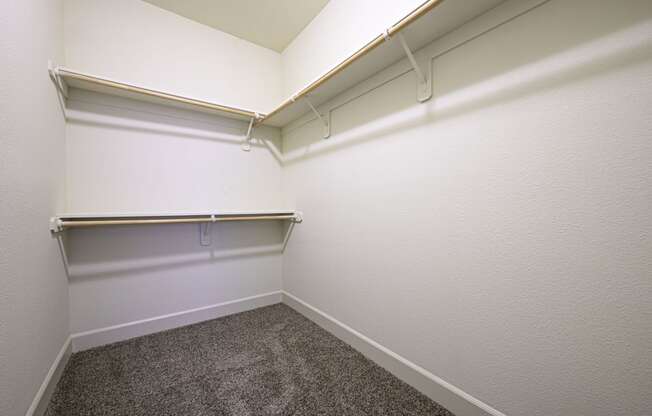 a small room with a carpeted floor and white walls