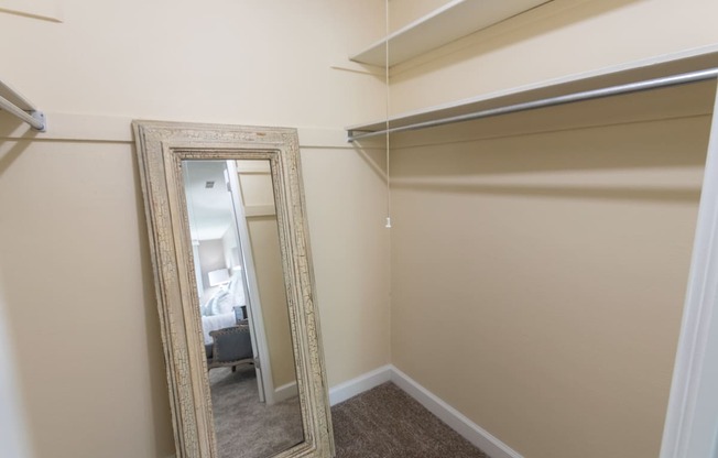 This is picture of the primary bedroom walk-in closet in the 823 square foot 2 bedroom apartment at Aspen Village Apartments in the Westwood neighborhood of Cincinnati, OH.