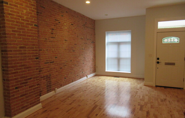 Charming 4 Bedroom/3.5 Bathroom Townhome with Parking Pad in Station North, MD!