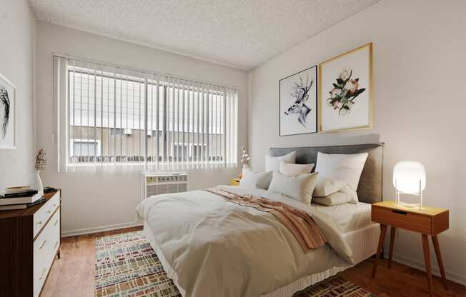 a bedroom with a large bed and a window