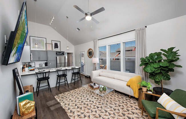 living room with kitchen view at the cottages