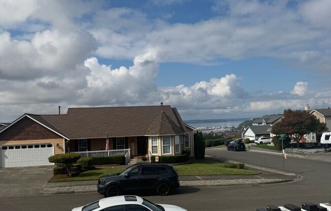 Bright NE Tacoma Home 3 Bedroom 2 Bath, Peaking Sound View with a 3 Car Garage & Fenced Yard!