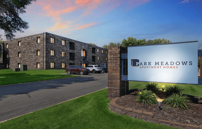 a view of the park meadows apartments from the street