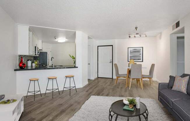 a living room with a couch and a table  at Masselin Park West, Los Angeles, California
