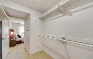 our apartments have huge extended closets with a door to the bedroom.