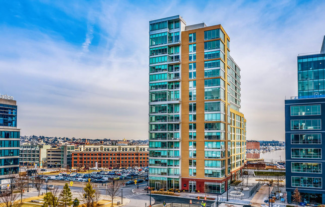 an aerial view of an office building with a city in the background