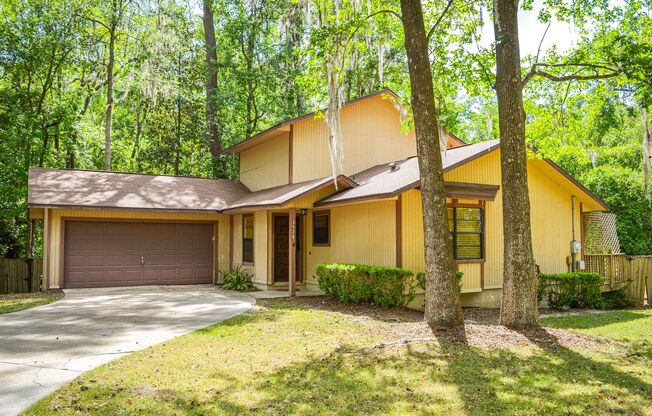 Check out this huge private fenced back yard at this Timberlane home!