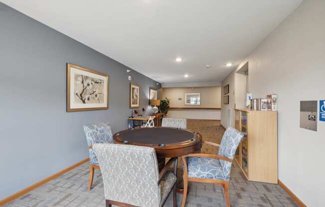 a dining room with a table and chairs and a living room