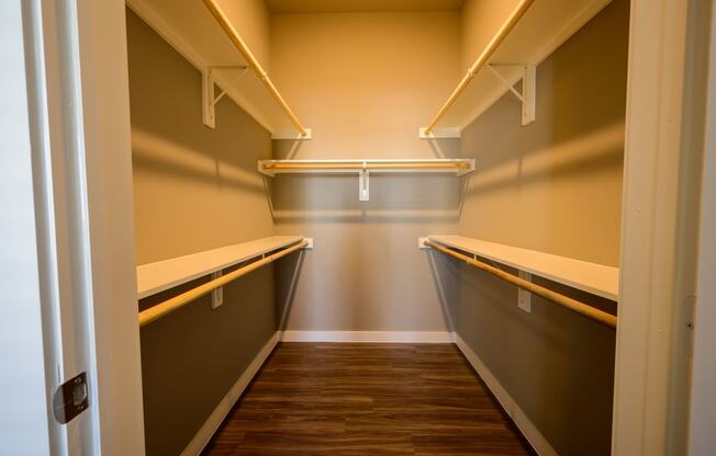 Harmony Luxury Apartments walk in closet with tall ceilings