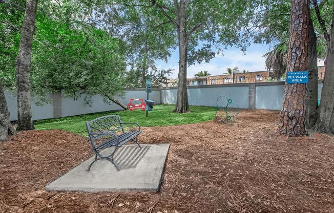 a bench in front of a tree