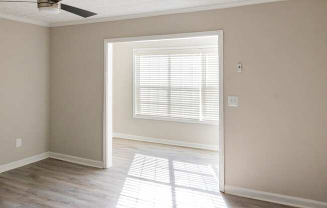 Living space with large windows for natural light at Twin Springs Apartments, Norcross, GA