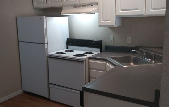 PRICED REDUCED!! Large windows and exposed brick wall