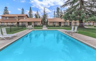 Relax on the pool deck at Camelot Square