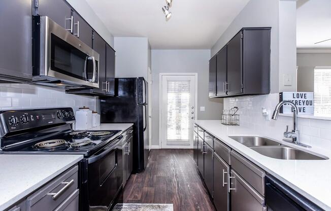 a modern kitchen with stainless steel appliances