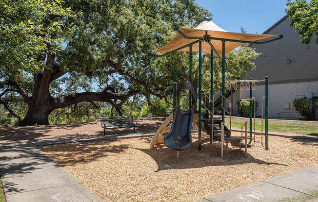 A playground with a shade structure at Sunset Summit, Rocklin, CA, 95765