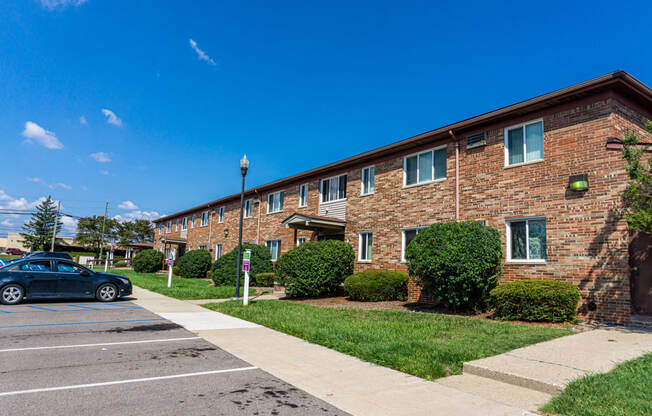 Exterior of apartment entrance at resident only parking at Golf Manor Apartments in Roseville, Michigan