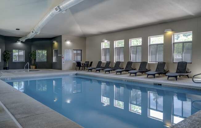 Indoor Saltwater Swimming Pool with lounge seating at Cascade Pines Duplex Homes in Lincoln NE