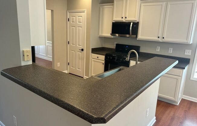 4 Bedroom | 3 Bathroom Apex Home with Fenced Backyard