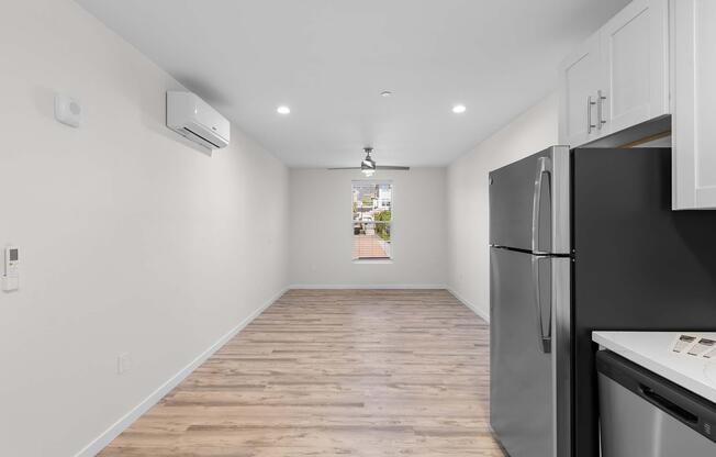 a kitchen with a sink and a refrigerator