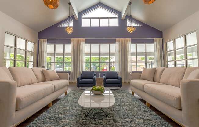 a large living room with couches and a coffee table
