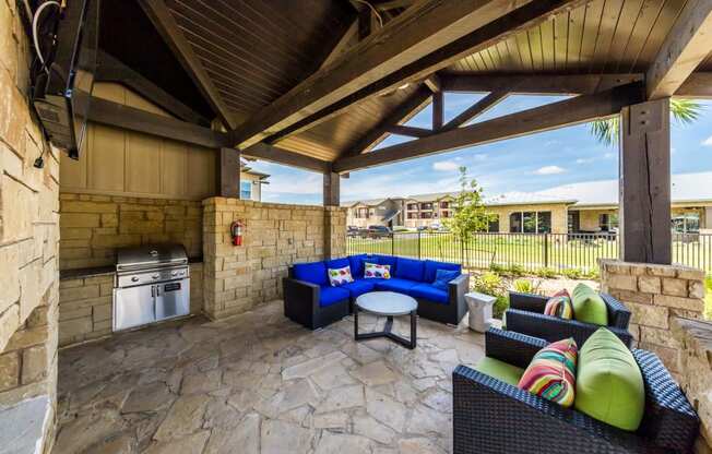 BBQ Area Inside Pool Area with Tables & Chairs