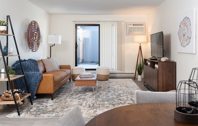 a living room with a couch and a table and a tv