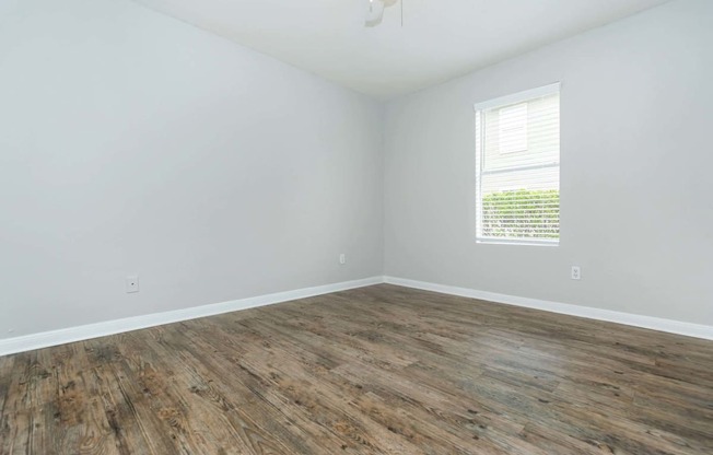 Bedroom with windowat Royal Wildewood Manor Apartments, Texas, 77531