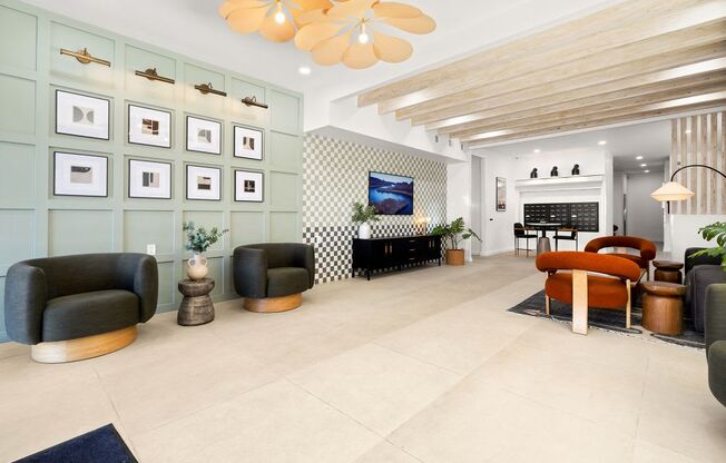 A living room with a wooden ceiling and a black and white checkered wall.