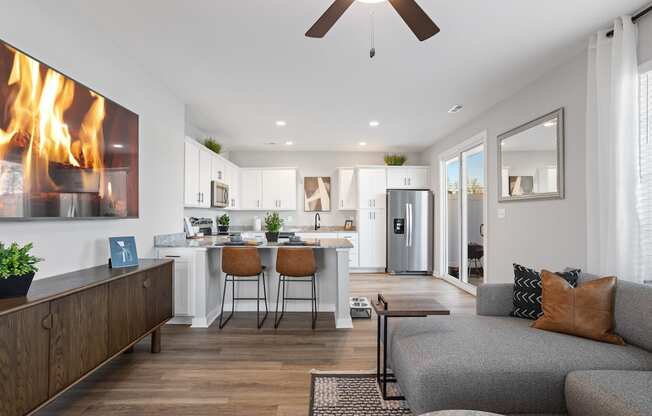 an open concept kitchen and living room in a home at Sanctuary at Indian Creek homes for rent near Cummings Research Park