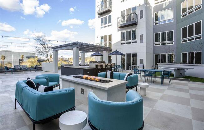 Circa Central large patio with blue chairs and a fire pit