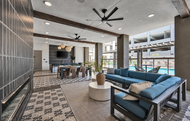 A modern living room with a pool view.