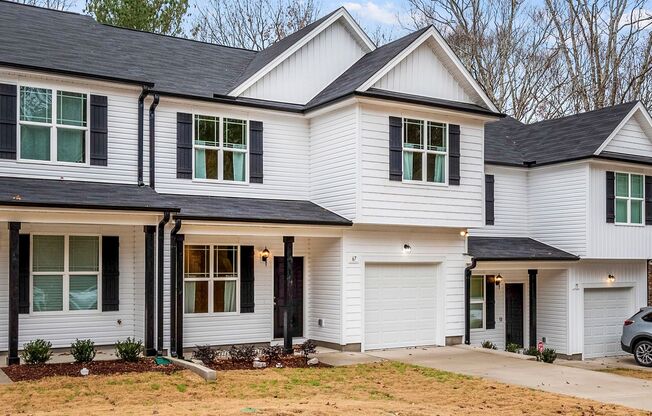 MOVE IN READY! BRAND NEW 4 bedroom 2.5 bathroom townhome with GARAGE and WOODED VIEW!