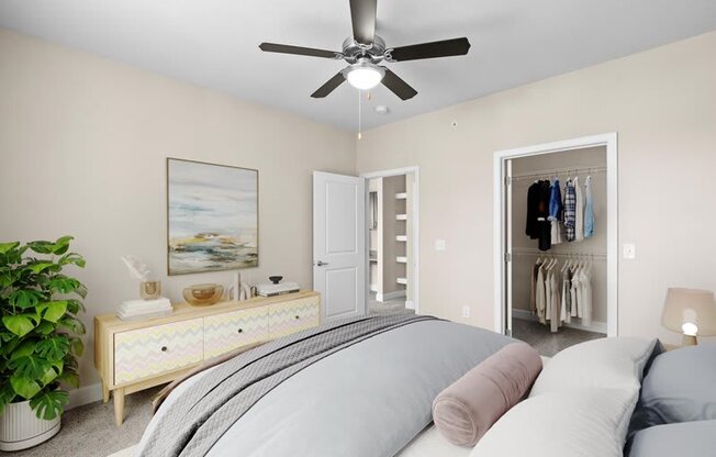 a bedroom with a bed and a ceiling fan