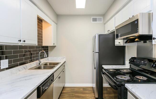 Well-lit kitchens at The Roosevelt Apartment Homes